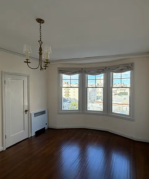Bedroom looking East. One of two closets visible.