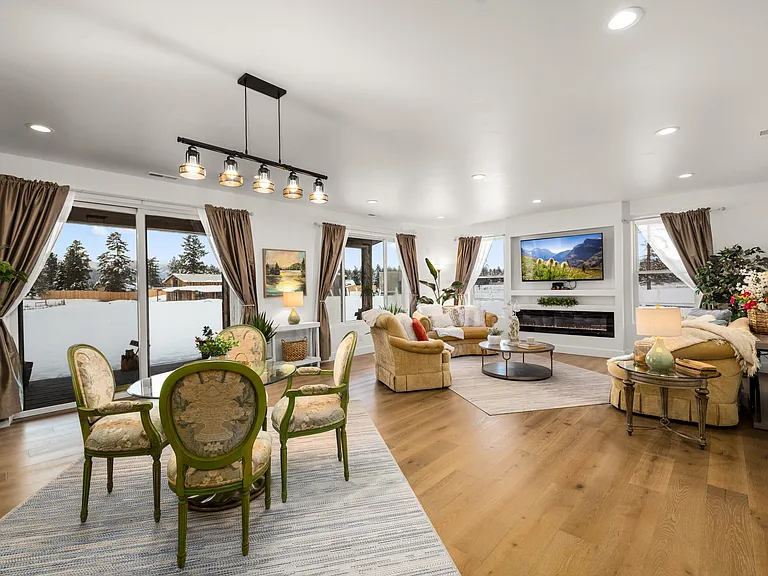 Bright and inviting dining and sitting area filled with natural light, creating a warm Montana atmosphere perfect for relaxing, gathering, and entertaining.