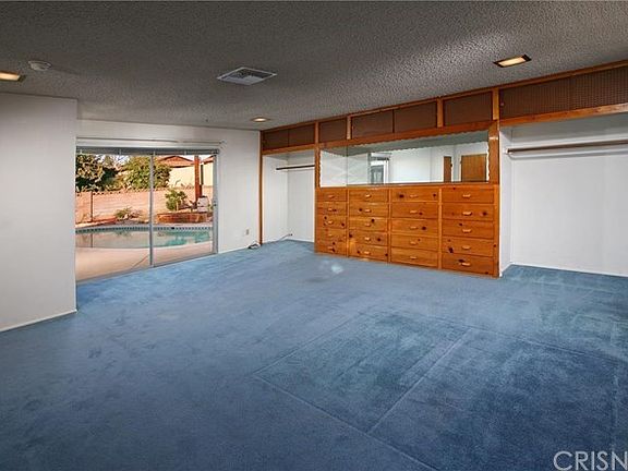 The expansive 20 x 20 family room serves as a sprawling master suite, is drenched in natural light, 