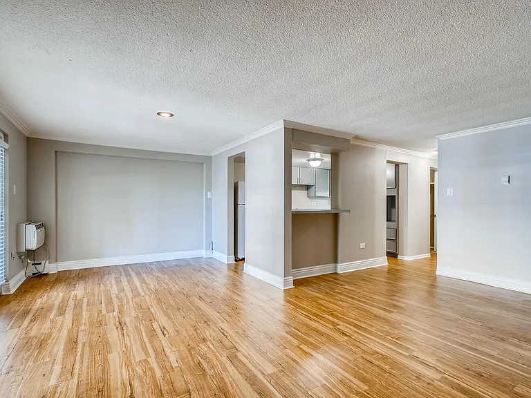 A Standard Living Room and Kitchen at Mondrian Colorado Apartments