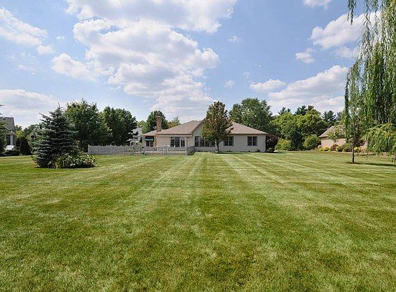 Deep Drive and 3 Car Side Load Garage.