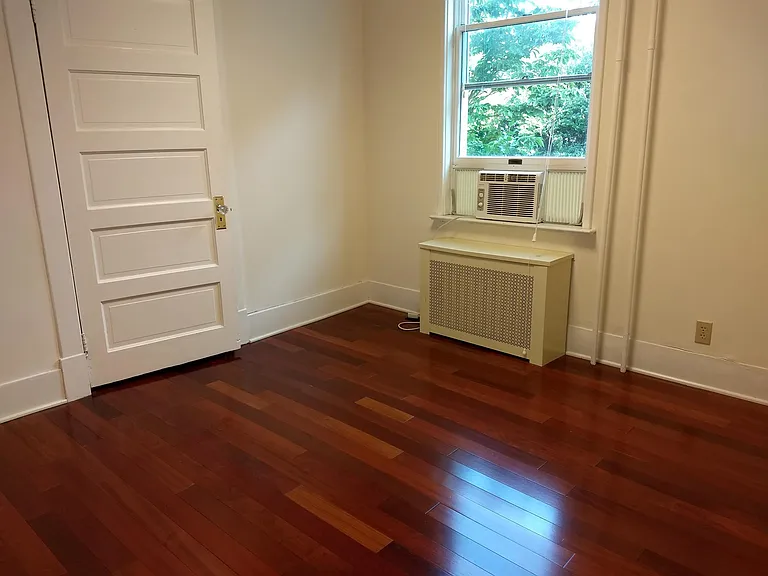 Bedroom #4 or office on first floor.
Radiator and window air conditioner have been removed.