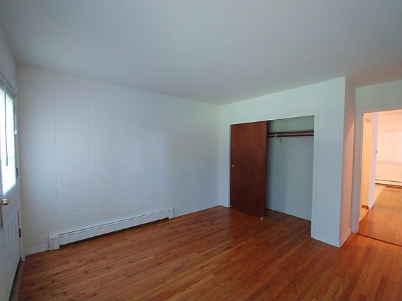 Bedroom 2 w/ shared balcony with neighbor