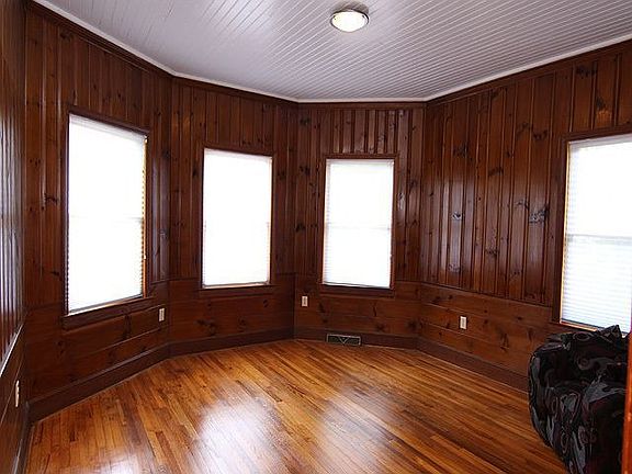 Large front bedroom with hardwood floors and lots of light 