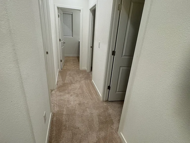 First floor walkway to master bed room, Laundry and other two bedrooms.