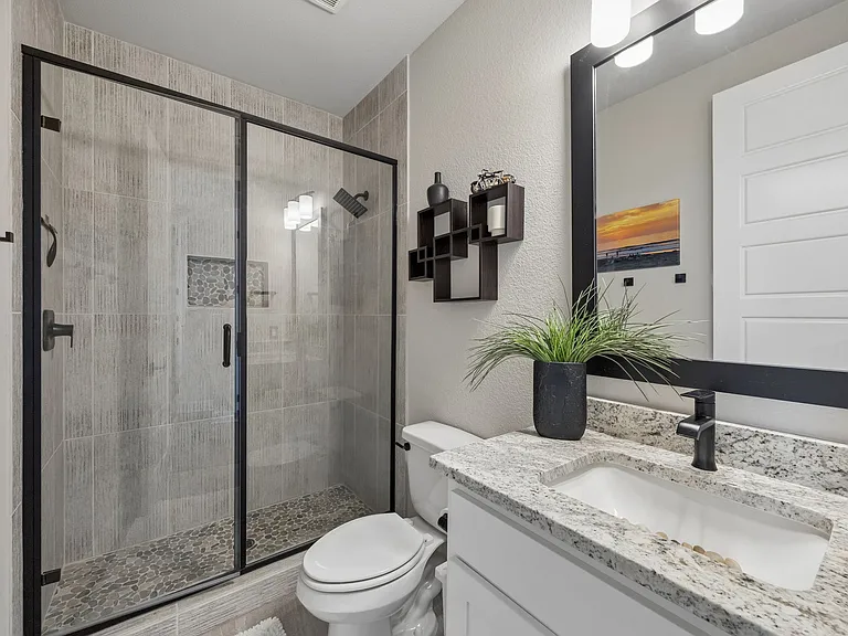 Upgraded bath #2 with large walk-in shower; lots of tile and stone floor to ceiling