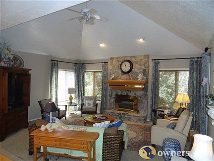 Family Room with stone gas fireplace, vaulted ceiling