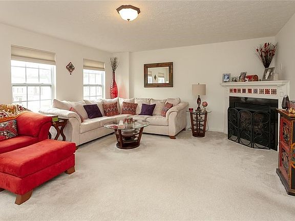 Truly a must see this family room offers tons of natural light and neutral carpet and is open to the large eat in kitchen.