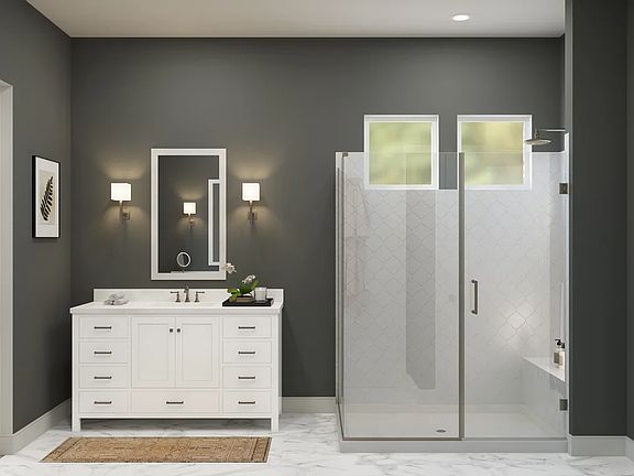 Primary bath with glass shower enclosure and vanity