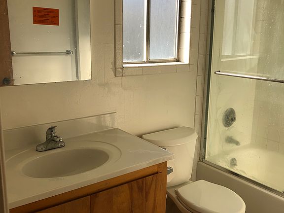 Full bathroom with double pane window