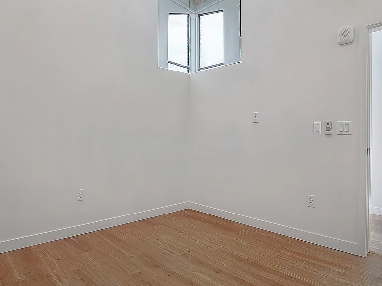 Natural light enhances this secondary bedroom.