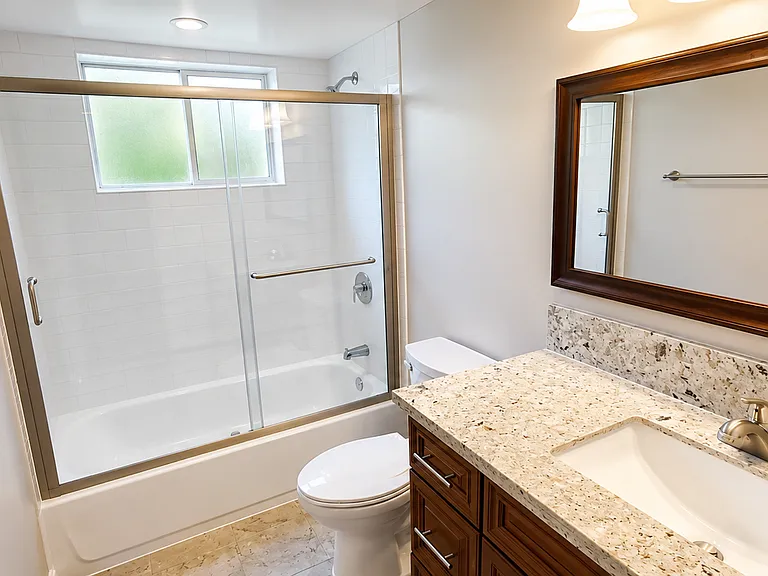 Remodeled bathroom with quartz countertops