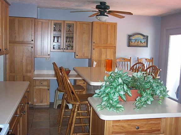 Ceramic tile floor in kitchen with corian countertops