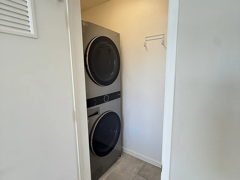 Newer Stacked Stainless Steel Washer and Dryer