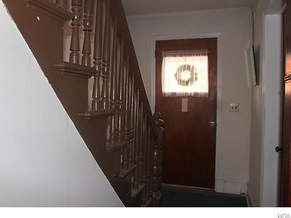 Shared front door entry foyer.  Separate entrances in rear for each apartment.