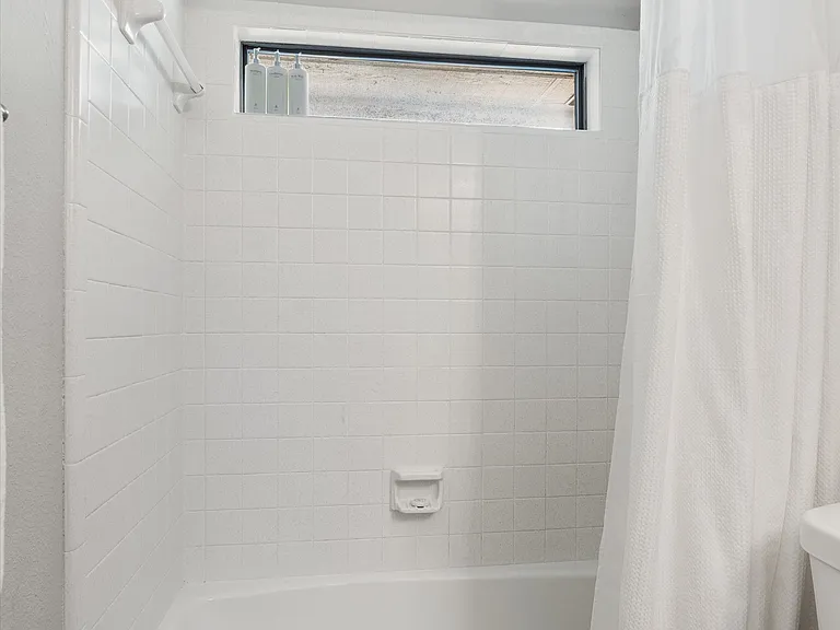 Hall Bathroom with Large Vanity with Lots of counterspace & 6 drawers. Tub Shower Combo with 2 layer Shower Curtain. All Linens Included
