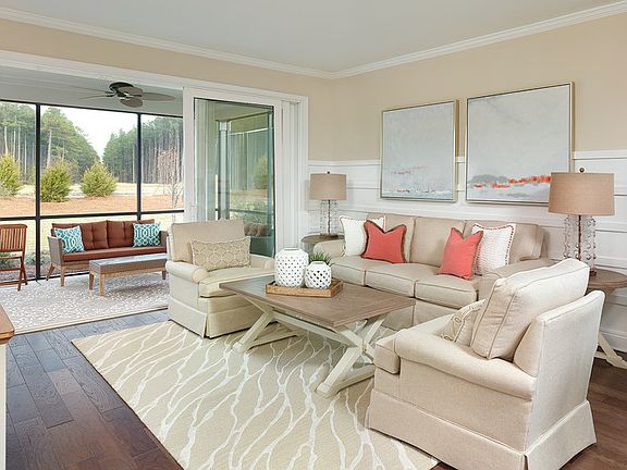 Bright and open gathering room with super sliders to connect the screened in porch.