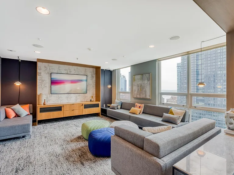 Fully equipped media room with ample seating, games, and an entertainment system.