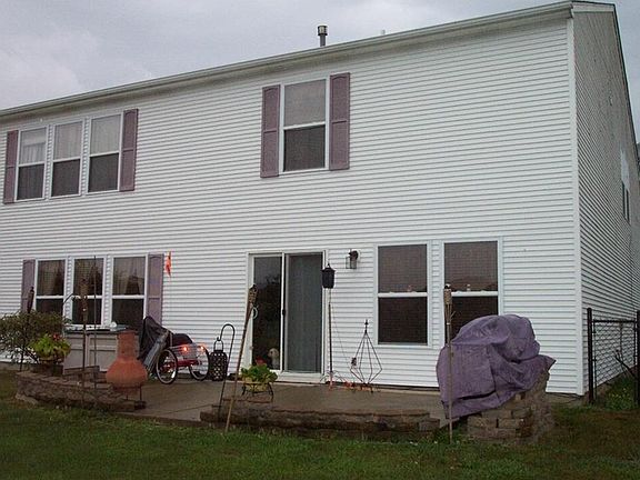 Since these owners have purchase this property they have replace screens, as well as added a patio and a chain link fence to this well landscaped yard!