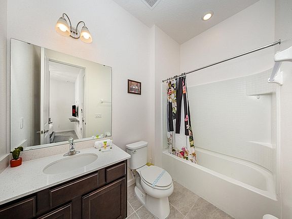 Enjoy the convenience of your own private ensuite bathroom featuring a full bathtub and shower, modern vanity.