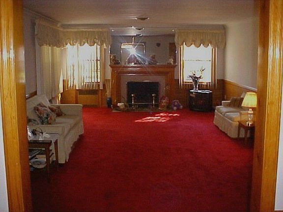 Spacious living room with a woodburning fireplace