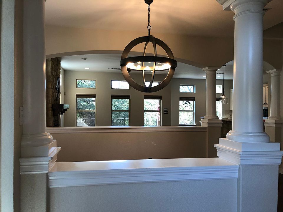 View of family room from dining area with upgraded light fixture.