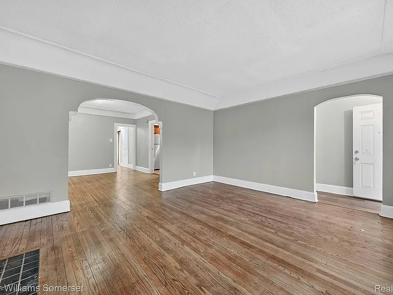 View from living room to entryway and dining room