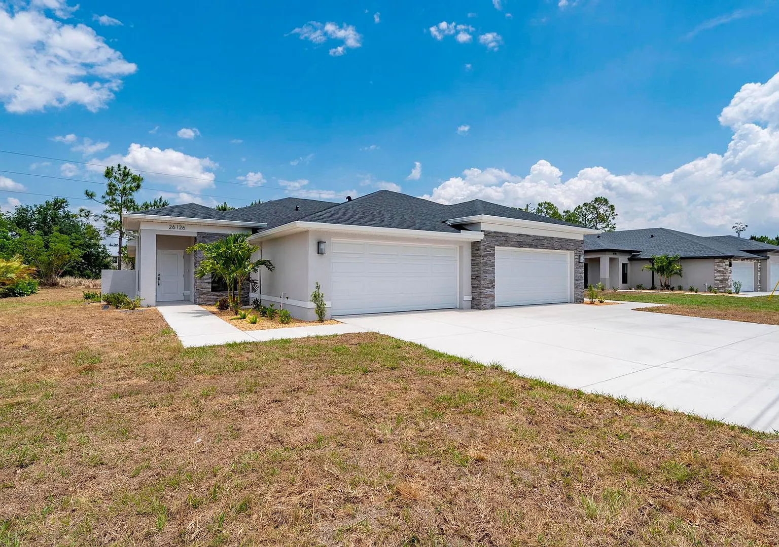 NEW Villa-duplex home with quartz counters, 2-car garage, and a rear patio — Photo 4