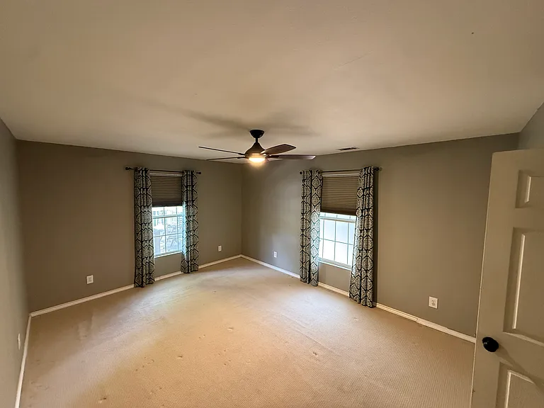 Primary (downstairs) bedroom - easily fits king bed and dressers!