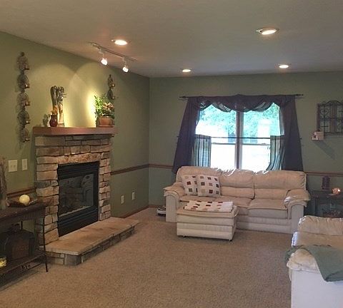 Open to dining room and kitchen. Enjoy those cool fall nights by the gas log fireplace