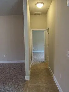 Family room looking to bedroom #4 and bathroom #3.
