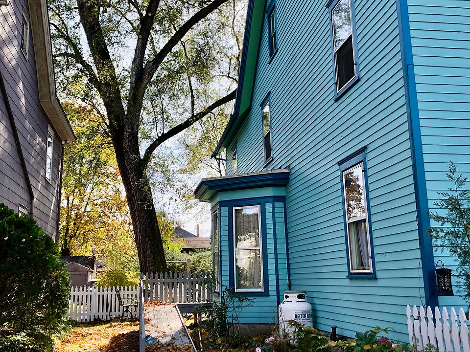 Wheelchair ramp at side entrance provides accessible entry to main house and back apartment.