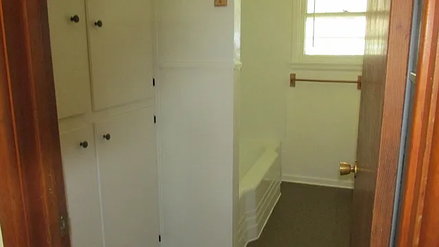 BATHROOM TUB AND LINEN CLOSET