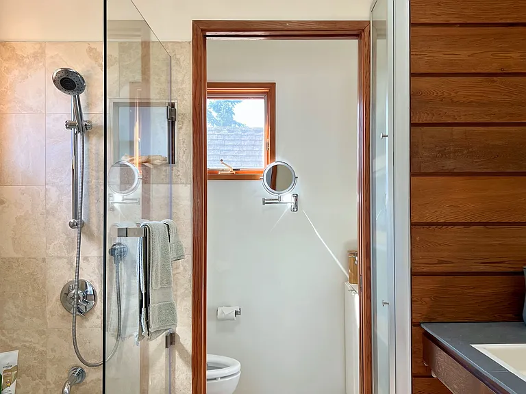 Primary Bathroom - stone tiles, cedar paneling