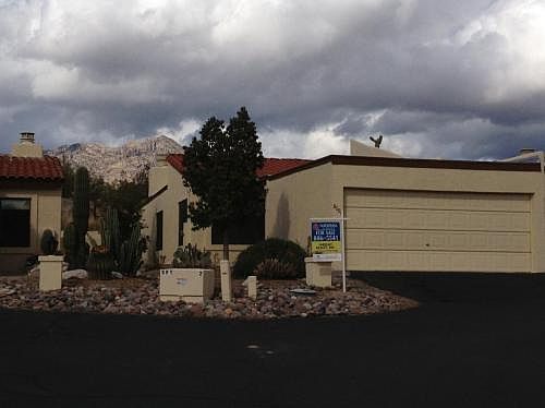 end unit with landscaped front yard