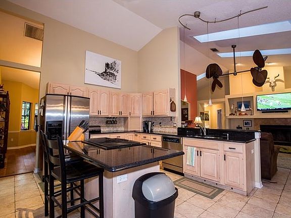 Large kitchen with granite countertops