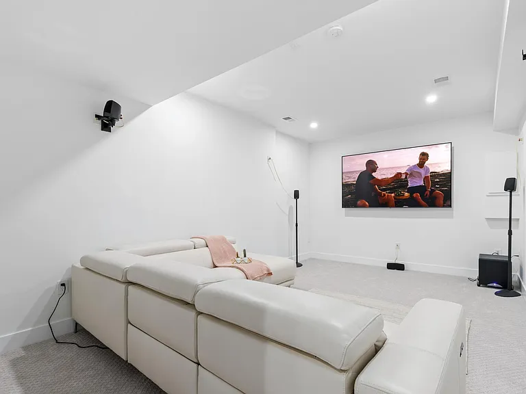 Movie theater with leather recliners, 86" SmartTV, and built-in 5.1 surround sound system!