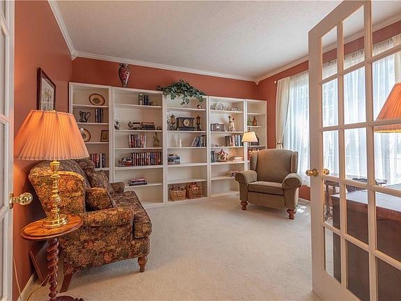 Den Office off foyer with full wall of bookcases (not built in but they stay with the home)!
