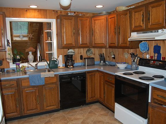 kitchen : all appliances stay; new floor, recessed lighting, electric range, dishwasher