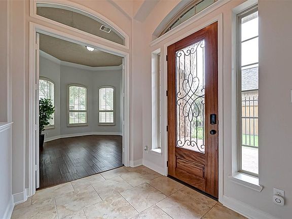 Entrance to your study! If you need a reason to work from home, the coffered ceiling, will lure you in! Double French doors for privacy are a plus!