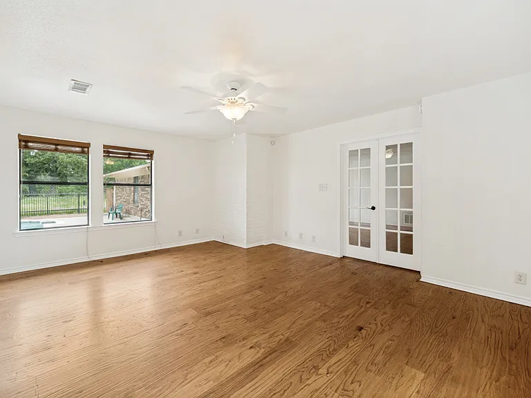 Family room - entry to living room; scenic view to the pool and country view.