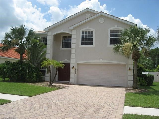 large lot, brick paver drive and sidewalk