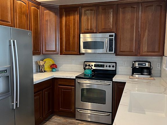 Kitchen equipped with espresso machine, can opener, toaster, pots/pans, dishes, etc. Everything for a fully functional kitchen.