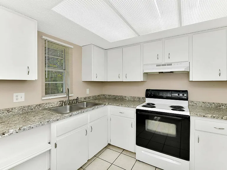 Step into a stylish kitchen that combines elegance and functionality.