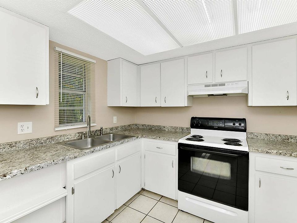 Step into a stylish kitchen that combines elegance and functionality.