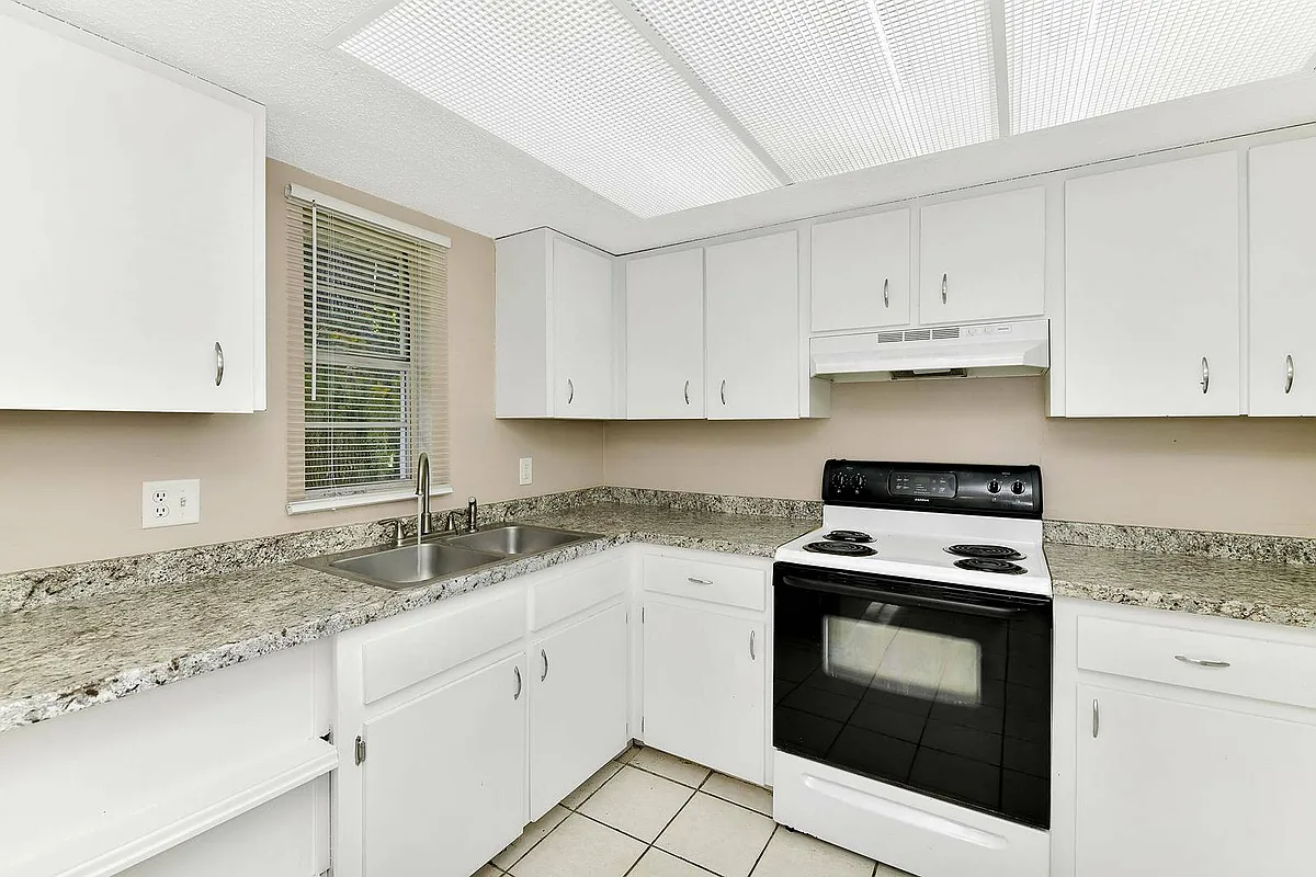 Step into a stylish kitchen that combines elegance and functionality. - Arbor Glade