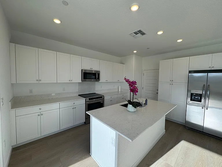 Open Kitchen with new appliances, huge island and plenty of cabinets
