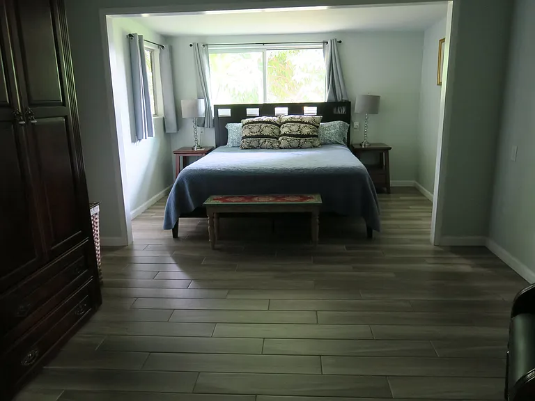 A king size bed with an adjoining room.