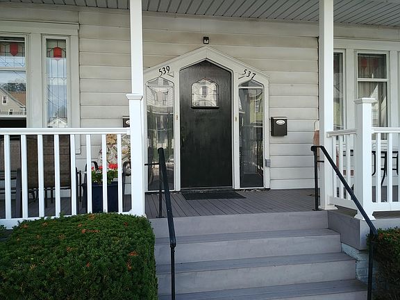 Extra wide covered front porch - lovely for sitting and watching folks stroll by.