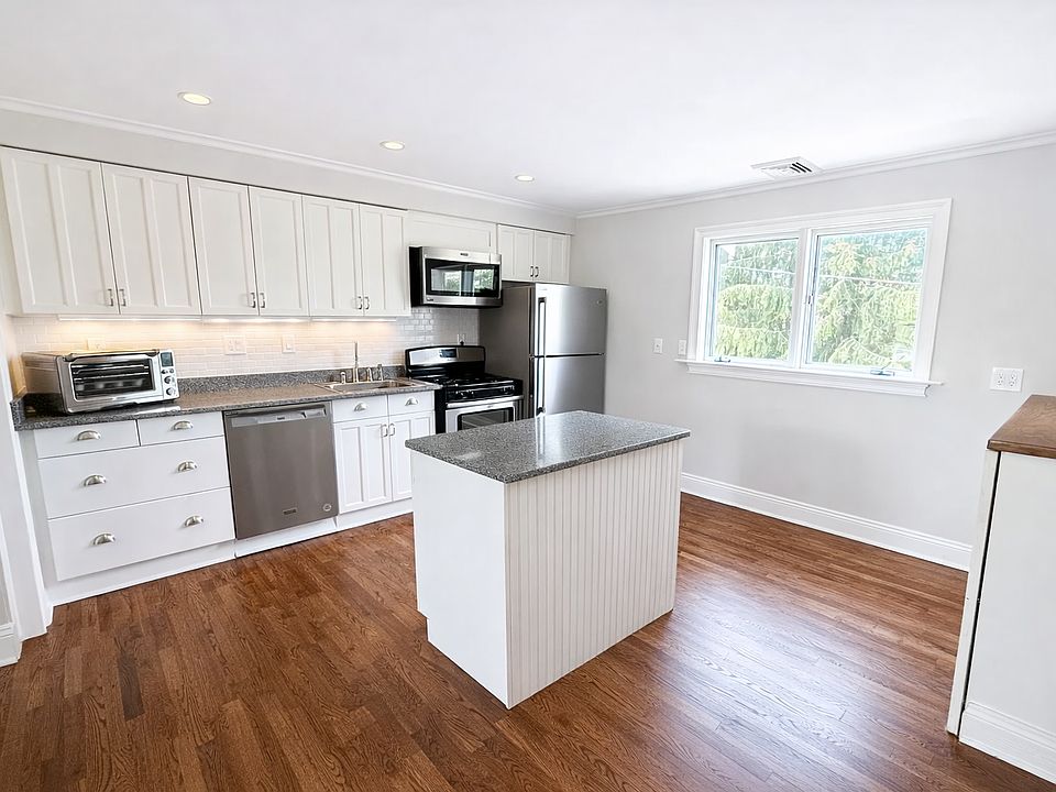 Open kitchen with stainless steel appliances